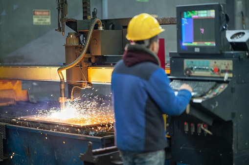 operator using laser cutting technology
