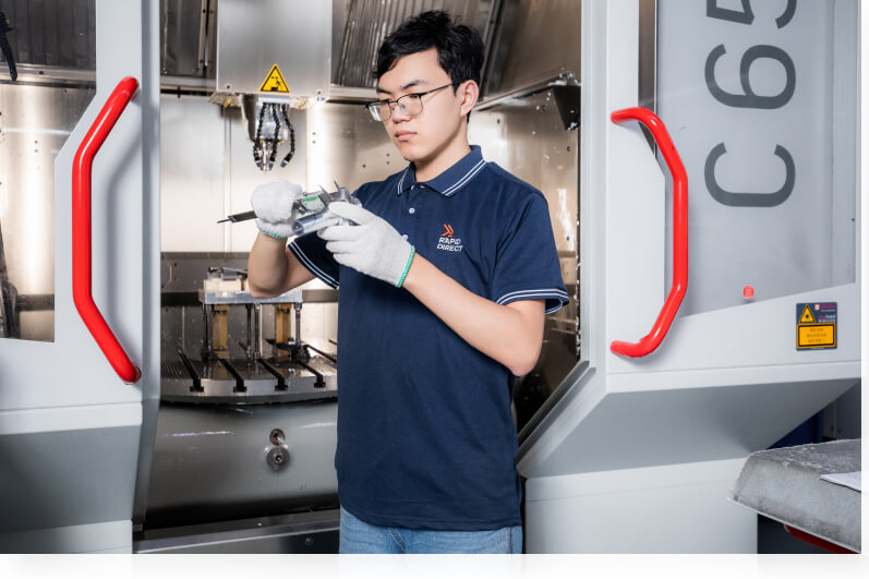  Quality inspector is inspecting CNC machined part during production